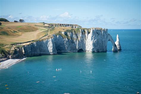 Visit Étretat's Striking White Chalk Cliffs and Magnificent Rock Arch | TravelAwaits