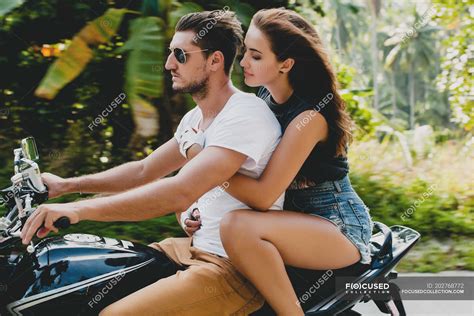 Young couple riding on motorcycle on rural road, Krabi, Thailand — man ...