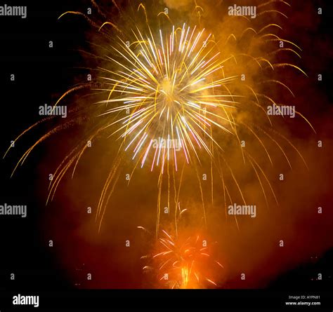 Fire crackers bursting in the sky at night Stock Photo - Alamy