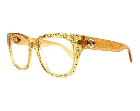 Shop now for Gucci glassesGG0037O 006 Glitter Gold - Transparent Gold ...