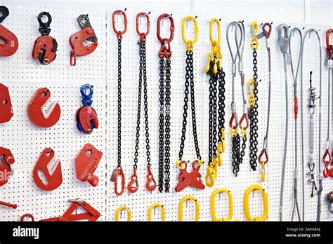 Lifting equipment and chains in exhibition store Stock Photo - Alamy