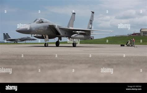 A U.S. Air Force 67th Fighter Squadron F-15 Eagle taxis after being fueled by service members of ...