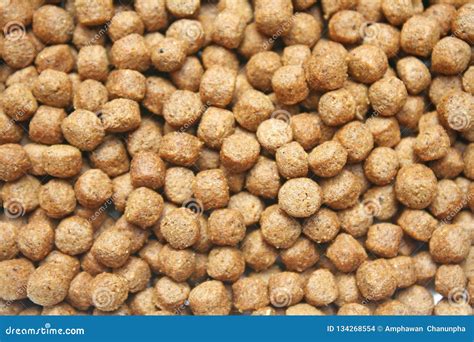 Pile of fish food pellets stock photo. Image of abstract - 134268554