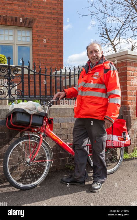 Royal Mail postman with his bike, Plumtree, Nottinghamshire, England ...