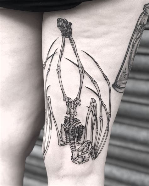 No photo description available. | Skeleton tattoos, Bat tattoo, Bone tattoos