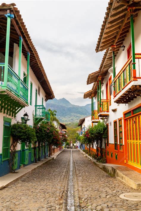 Premium Photo | Village in the mountains of colombia with traditional colonial houses of ...