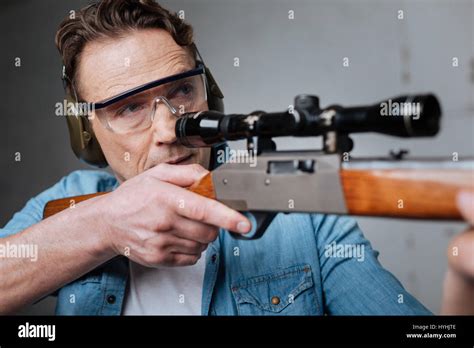 Skilled professional marksman having target practice Stock Photo - Alamy