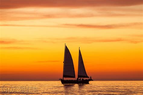 Sailboat Silhouette with the Sunset Afterglow in the Gulf