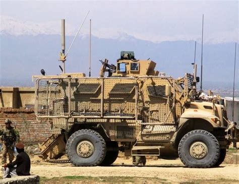 Navistar Defense MaxxPro MRAP vehicle with Rocket Propelled Grenade (RPG) nets at work ...