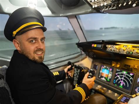 A Man is Studying To Be a Pilot in a Flight Simulator. Close-up of Male Hands on the Control ...