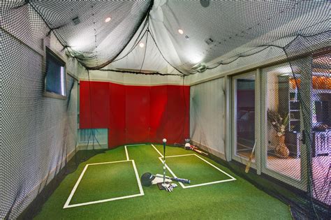 Built for both golf and baseball, this batting cage was designed and installed by Practice ...