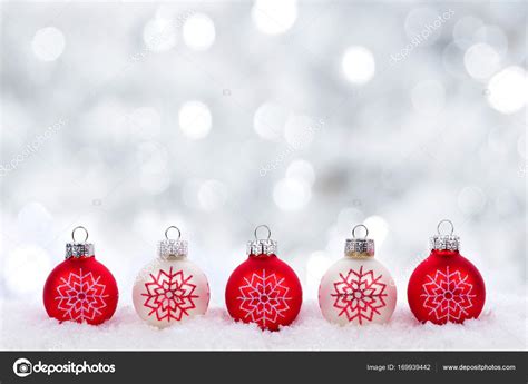 Red and white Christmas ornaments with twinkling background Stock Photo by ©JeniFoto 169939442