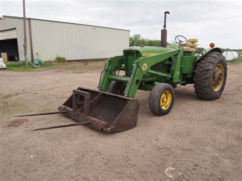 John Deere Diesel 3020 with JD 148 Loader - Bodnarus Auctioneering