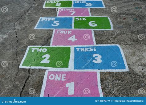 Jumping Game of Small Children on the Playground. Stock Photo - Image ...