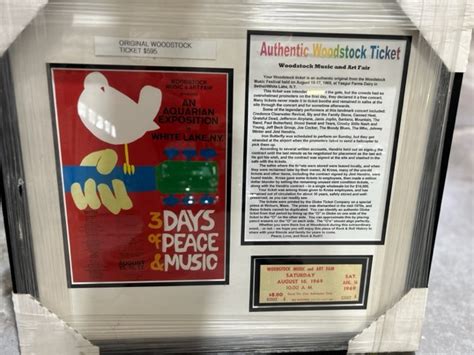 #M141 - Woodstock framed a picture with an original Woodstock ticket | MAG Auctions