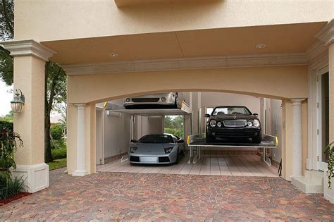 Hydraulic lifts maximize space and turn your two-car garage into a four-car garage. | Garaje ...