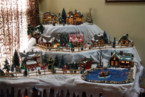 our snowvillage love love love it! My hubby made my display table | Christmas village display ...