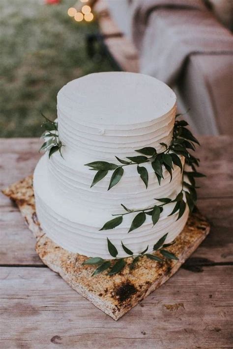 simple and rustic wedding cake with greenery - EmmaLovesWeddings