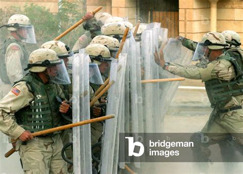 Image of U.S. MILITARY POLICE HOLDS RIOT CONTROL TRAINING IN FRONT OF