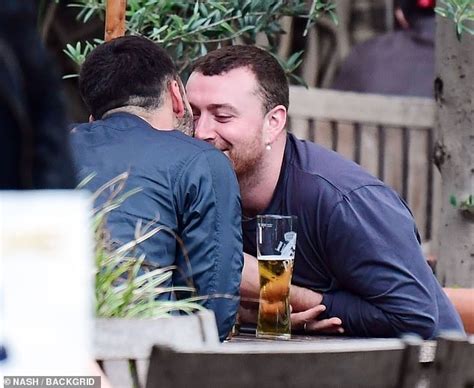 Sam Smith looks smitten as they passionately kiss hunky new boyfriend Francois Rocci - ReadSector