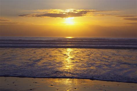 Sunset Over The Pacific Ocean Along The Photograph by Craig Tuttle ...