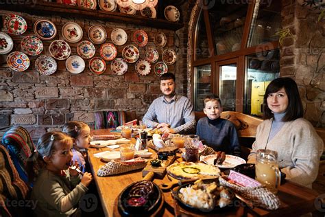 Family having a meal together in authentic ukrainian restaurant ...