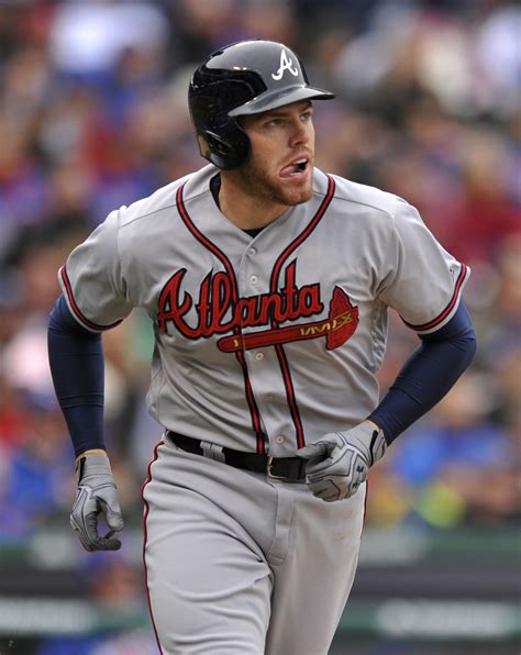 Atlanta Braves' Freddie Freeman watches his solo home run during the ...