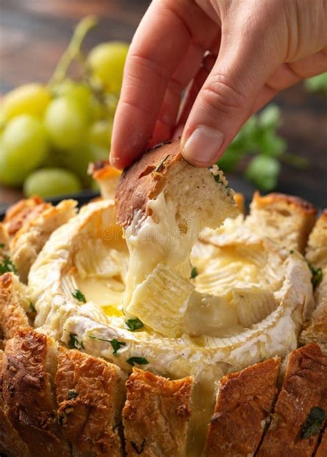 Baked Camembert Cheese in Sourdough Bread with Rosemary, Garlic, Thyme Stock Photo - Image of ...