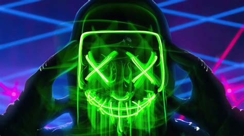 Download A Man With A Green Mask And Neon Lights Wallpaper | Wallpapers.com