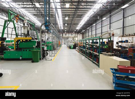 Machinery in a factory warehouse building Stock Photo - Alamy