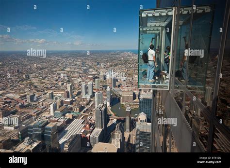 Tourists in glass balcony skydeck observation deck view Chicago ...