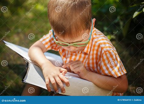 Cute Baby Boy with Glasses Reading the Book in Summer Day.Outdoors, Back To School Concept ...