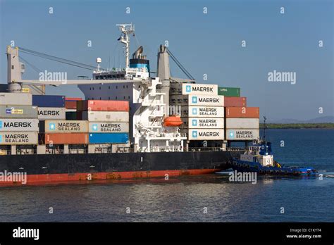 Container ship with tug arriving at the Port of Corinto, Nicaragua ...