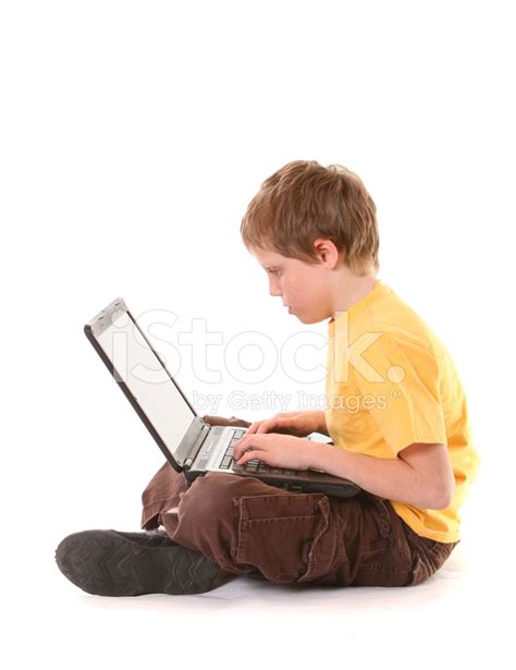 Boy Typing On A Notebook Computer Stock Photo | Royalty-Free | FreeImages