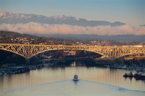 Boat Under Bridge With View of Mountains · Free Stock Photo