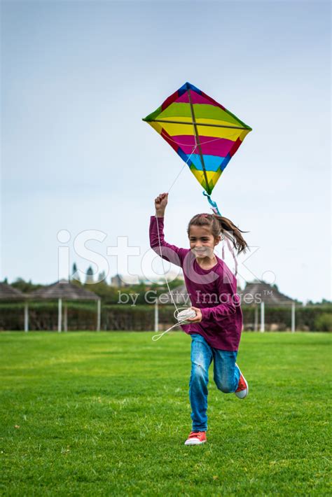 Girl Flying A Kite In The Park Stock Photo | Royalty-Free | FreeImages