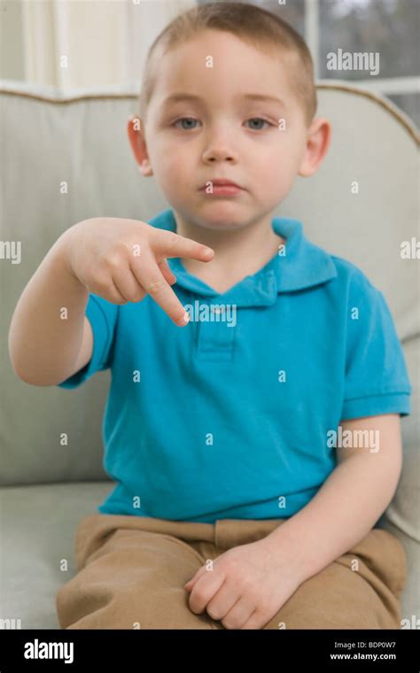 Boy signing the letter 'P' in American Sign Language Stock Photo - Alamy