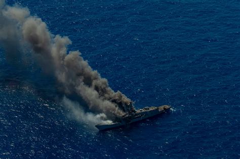 Smoke billows from the decommissioned guided missile frigate ex-USS ...