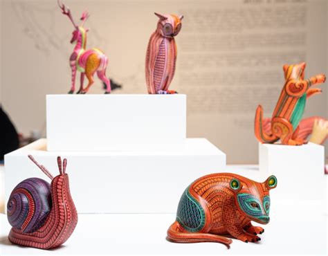 Vibrant Patterns Envelop Dozens of Mythical Animal Sculptures That ...