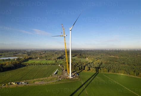 Aerial view of wind turbine under construction in field stock photo