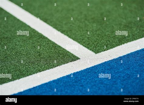 Field hockey is tons of fun. Closeup shot of markings on a hockey field Stock Photo - Alamy