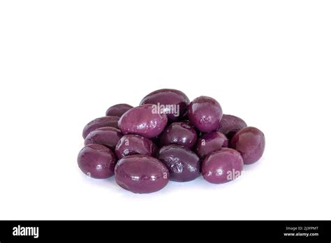 pile of purple olives isolated on a white background Stock Photo - Alamy