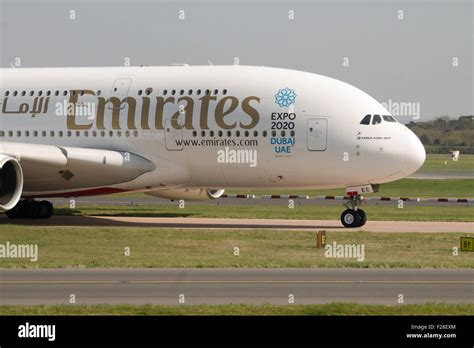 Emirates Airbus A380 double-decker passenger plane taxiing on Manchester Airport taxiway Stock ...