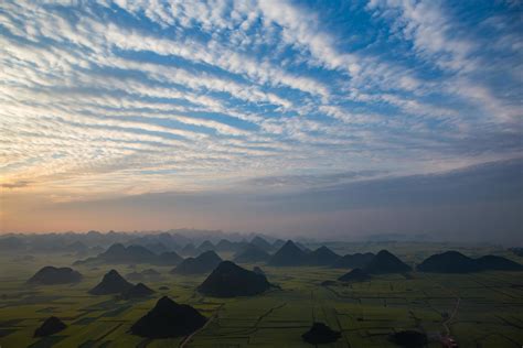 Yellow rapeseed flower field in Luoping, China 9587294 Stock Photo at Vecteezy