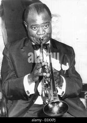 Louis Armstrong playing his trumpet Stock Photo - Alamy