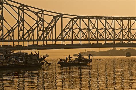 Calcutta - Hooghly_River and Howrah Bridge at sunset Photograph by Urs Schweitzer - Fine Art America