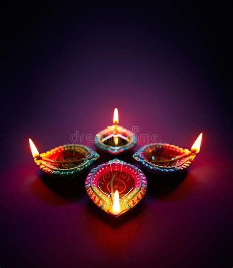 Diwali oil lamp. Colorful clay diya lamps lit during diwali celebration ...