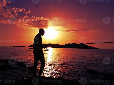 Fisherman at sunset 798214 Stock Photo at Vecteezy