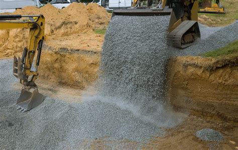 Construction of Foundation Excavator Works in a Gravel Pit Uploading of Stone Stock Image ...