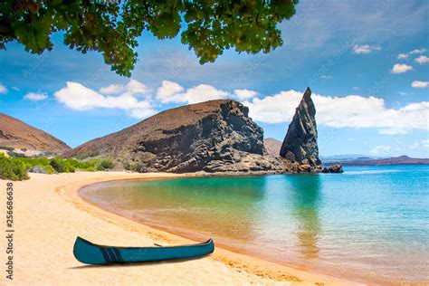 Galapagos Islands. Ecuador. Bartolome Island. Pinnacle Rock. Rocks in the water next to the ...